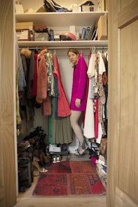 a woman standing in a closet