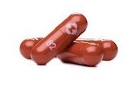 three red capsules on a white background