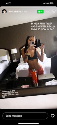a woman is taking a selfie in a hotel room