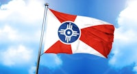 the flag of nebraska flying in the sky