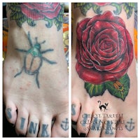 a woman's foot with a tattoo of a rose and a beetle