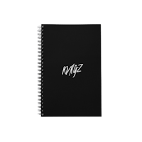 a black spiral notebook with the word nizz on it
