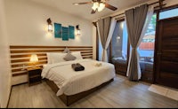 a bed or beds in a room at koh samui villa