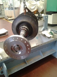 a machine is being used to make a metal part