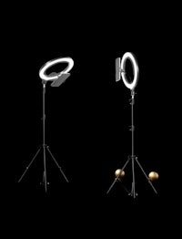 a pair of tripods with a ring light on them
