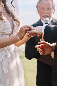 a bride and groom exchange rings during their wedding ceremony