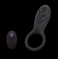 a black and purple vibrating toy next to a purple button