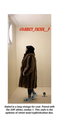 a man in a fur coat standing in a hallway