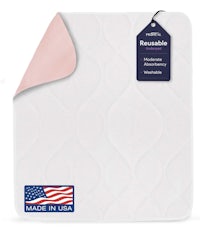 the made in usa mattress pad is white with a pink tag