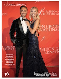 a man and woman pose on the cover of fashion group international magazine