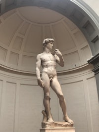 a statue of david in a museum
