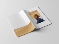 an open book with a photo of a woman