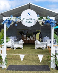 a white tent with blue and white decorations