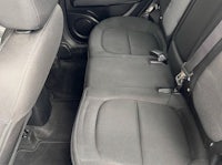 the back seat of a car with gray seats