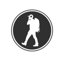 a silhouette of a man walking with a backpack
