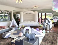 a room filled with balloons and a play area