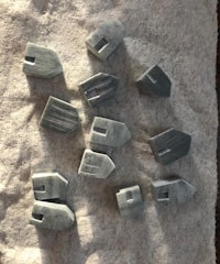 a group of gray marble pieces on a piece of cloth