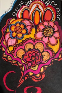 a drawing of a heart with colorful flowers on it