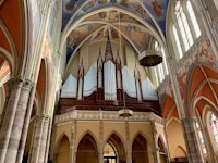 the interior of a church with a large organ