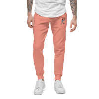 a man wearing a pink sweatpants with a white t - shirt