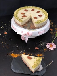 a slice of pistachio cheesecake on a plate