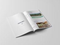 a white brochure with a picture of a resort