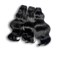 three bundles of black curly hair on a black background