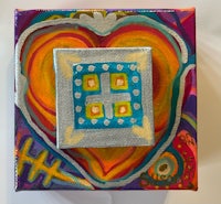 a colorful painting of a heart with a cross in the middle