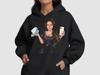 a black hoodie with an image of a woman holding a cell phone