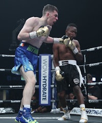 two boxers in action in a boxing ring