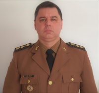 a man in a military uniform posing for a photo