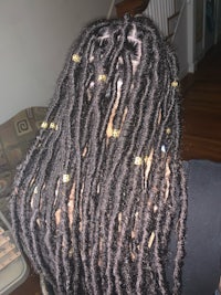 the back of a woman with dreadlocks