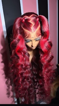 a mannequin with long red hair