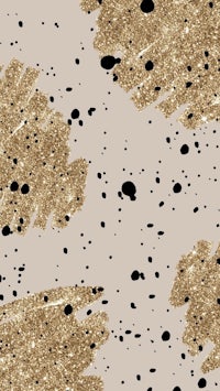 gold and black paint splatters on a beige background