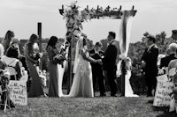 a black and white photo of a wedding ceremony
