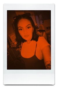 a polaroid photo of a woman with glasses