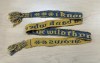 two blue and yellow scarves with the words'be the wild one' written on them
