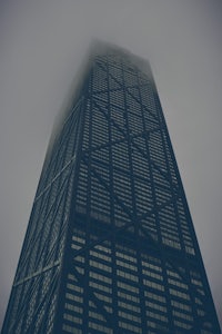 an image of a tall building in a foggy day