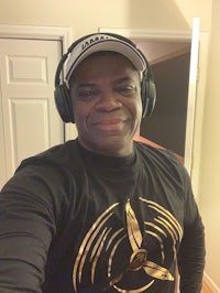 a man wearing headphones and a t - shirt
