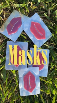 a set of lipstick masks in the grass