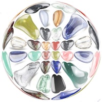 a circle with many different colored stones in it