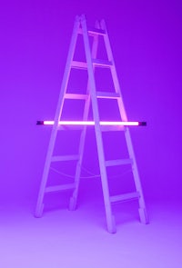 a ladder with a purple light on it
