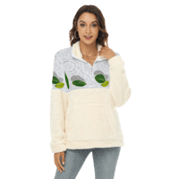a woman wearing a white sweatshirt with green leaves on it