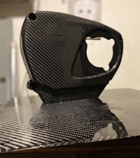 a black carbon fiber cover on top of a table