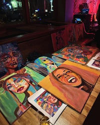 a group of paintings on a table