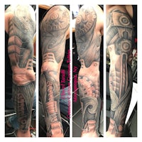 sleeve tattoo of a man with a robot on his sleeve