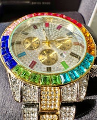a rainbow colored watch with diamonds on it