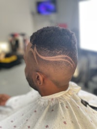 a man's hair with a design on it