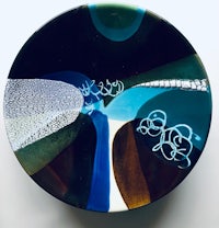 a plate with a blue and black design on it