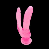 a pink rabbit shaped sex toy on a black background